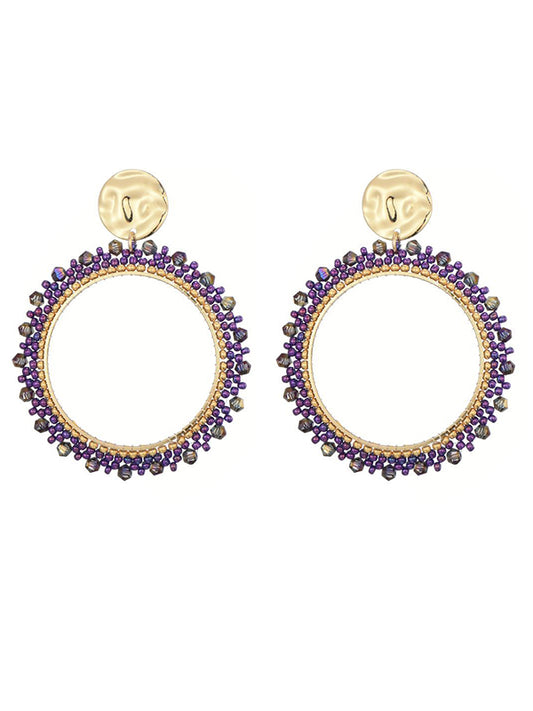 Goudkleurige oorbellen met paarse miyuki beads