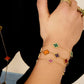 Armband drie kleurrijke klavers - paars