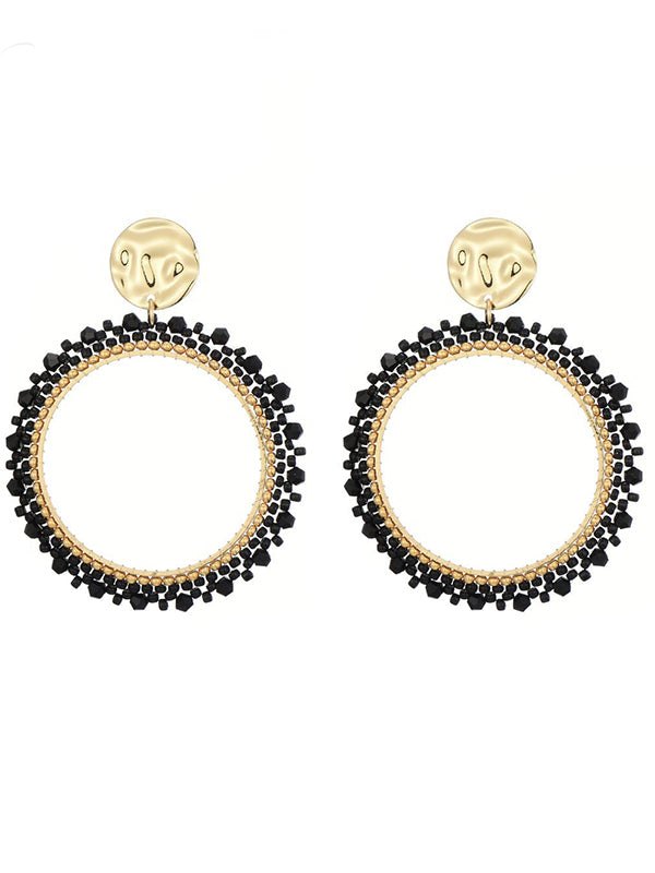 Goudkleurige oorbellen met zwarte miyuki beads